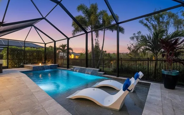 a large kitchen with stainless steel appliances kitchen island granite countertop a sink a counter top space and cabinets