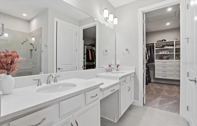 an aerial view of residential houses with outdoor space and swimming pool