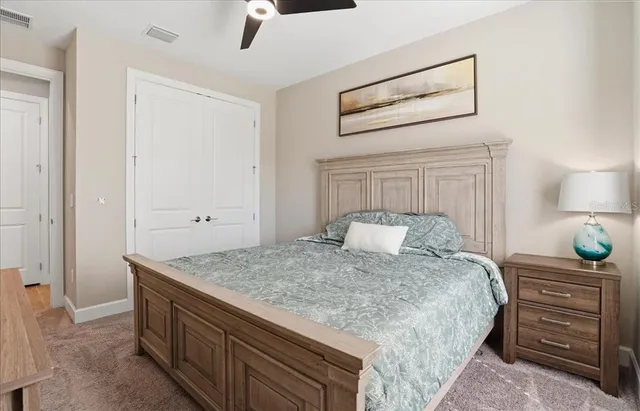 an aerial view of a house with a garden and lake view