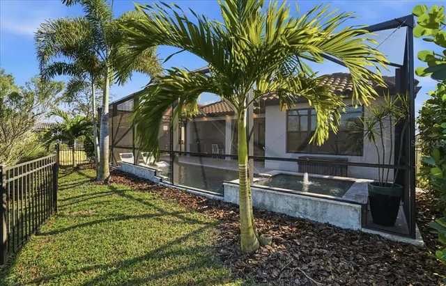 a swimming pool with outdoor seating and yard