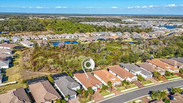a view of a backyard with sitting area