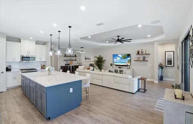 a large kitchen with a table and chairs