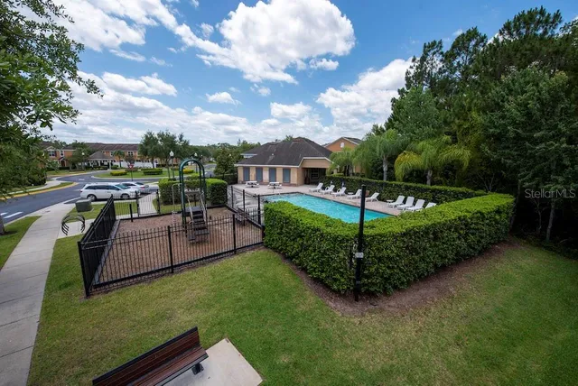 a view of a garden with furniture