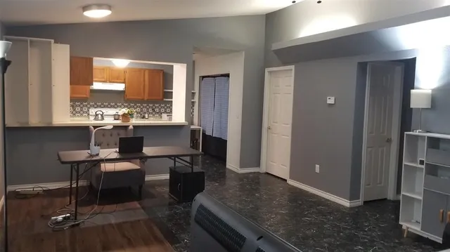 a kitchen with a sink cabinets and window