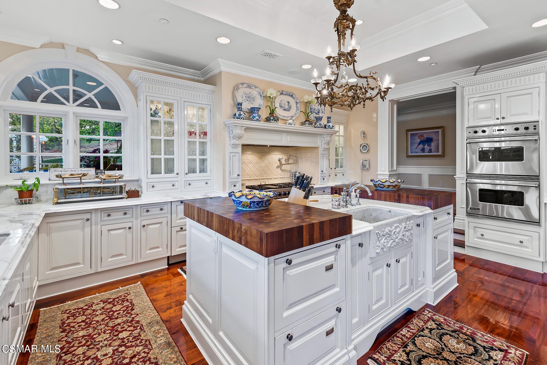 2155 Upper Ranch Road Westlake Village, CA 91362 - Photo 13 of 52 a kitchen with stainless steel appliances granite countertop a sink and a stove