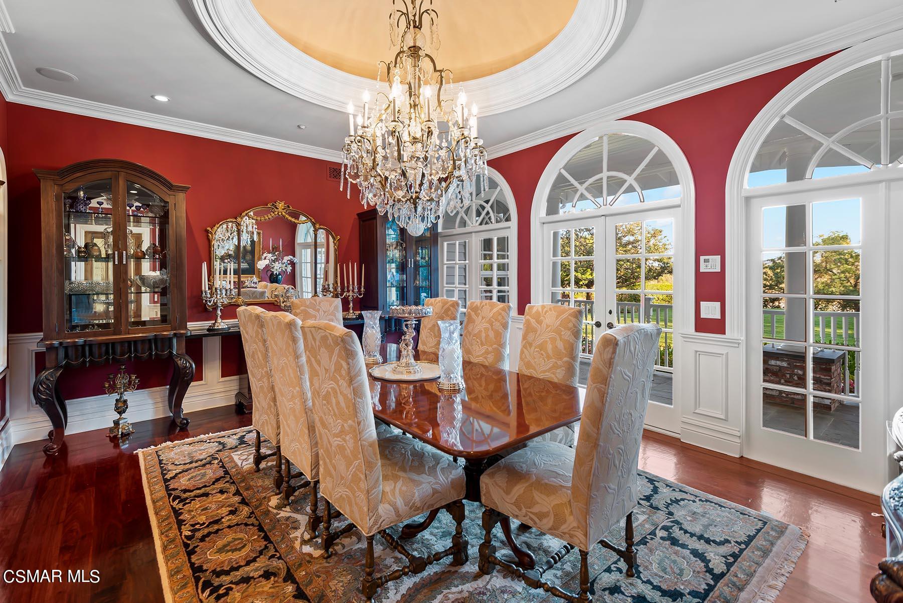 2155 Upper Ranch Road Westlake Village, CA 91362 - Photo 20 of 52 a view of a dining room with furniture a chandelier and wooden floor