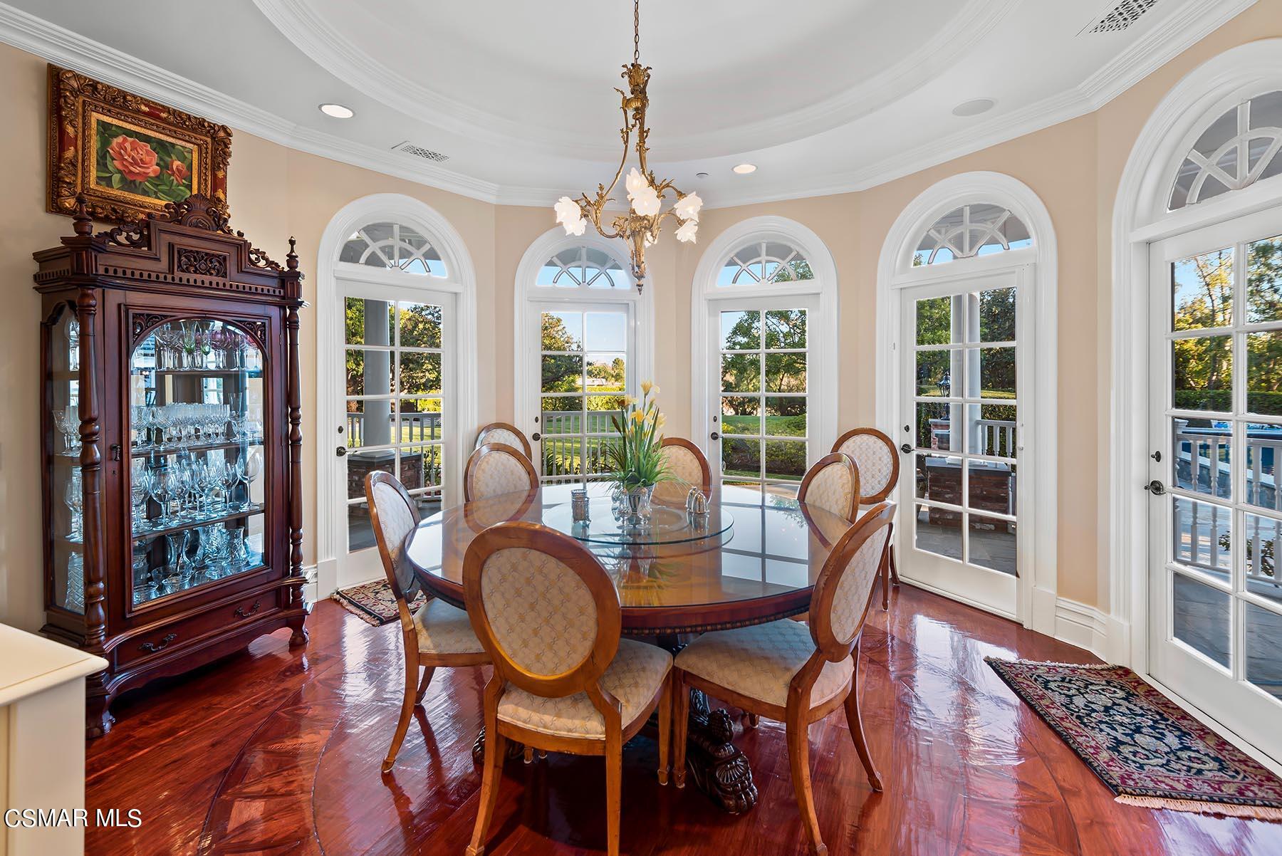 2155 Upper Ranch Road Westlake Village, CA 91362 - Photo 22 of 52 a view of a dining room with furniture wooden floor and chandelier