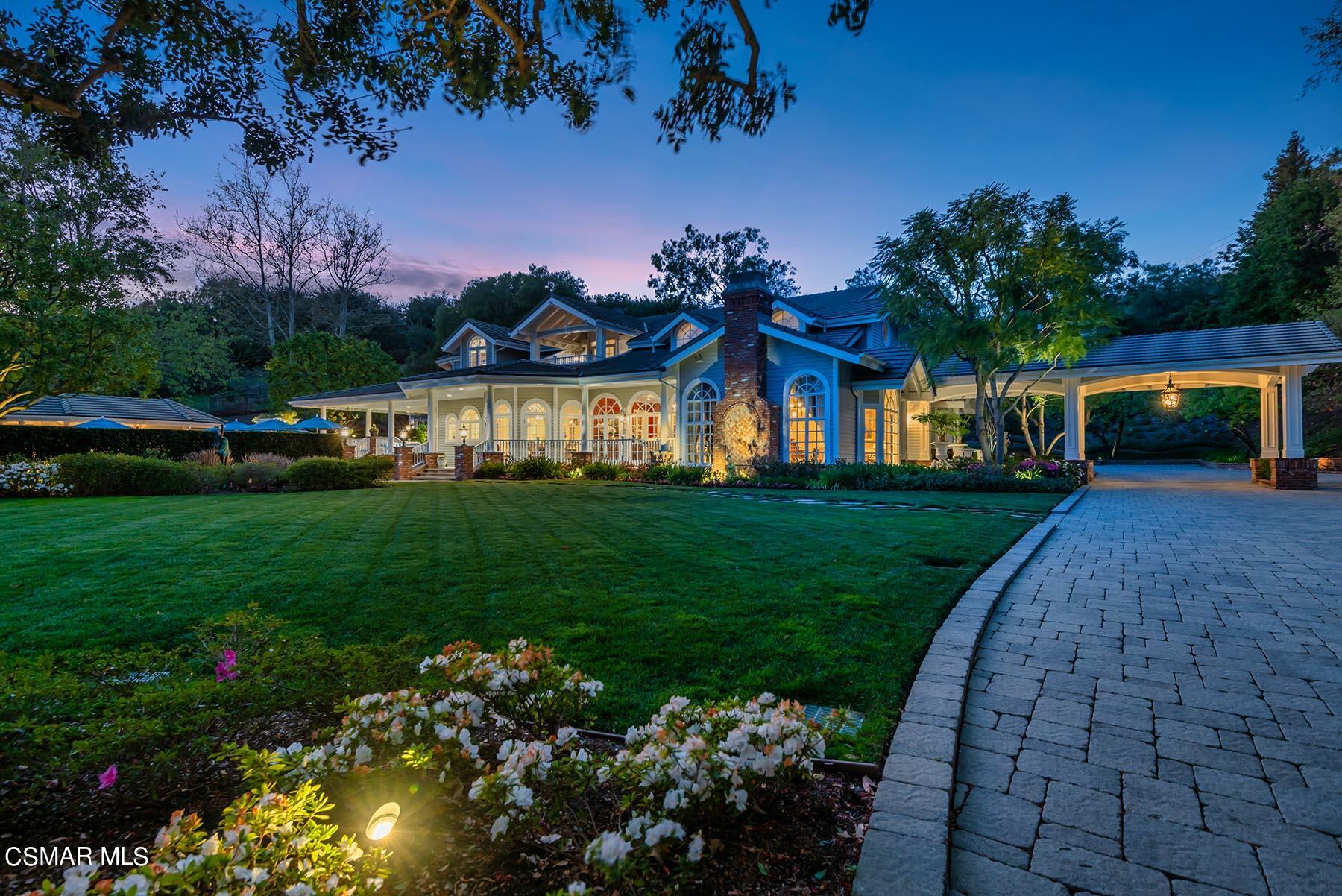 2155 Upper Ranch Road Westlake Village, CA 91362 - Photo 3 of 52 a front view of a house with a garden and trees