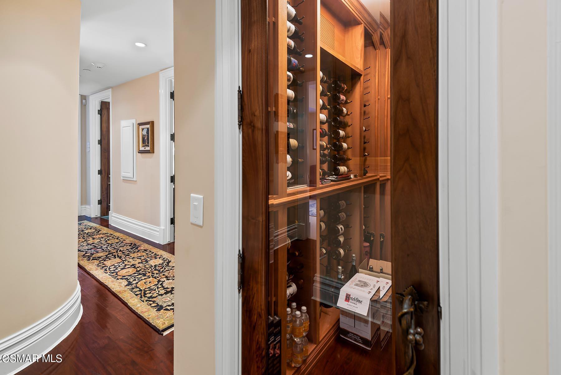 2155 Upper Ranch Road Westlake Village, CA 91362 - Photo 31 of 52 a view of a hallway with wooden floor and bathroom