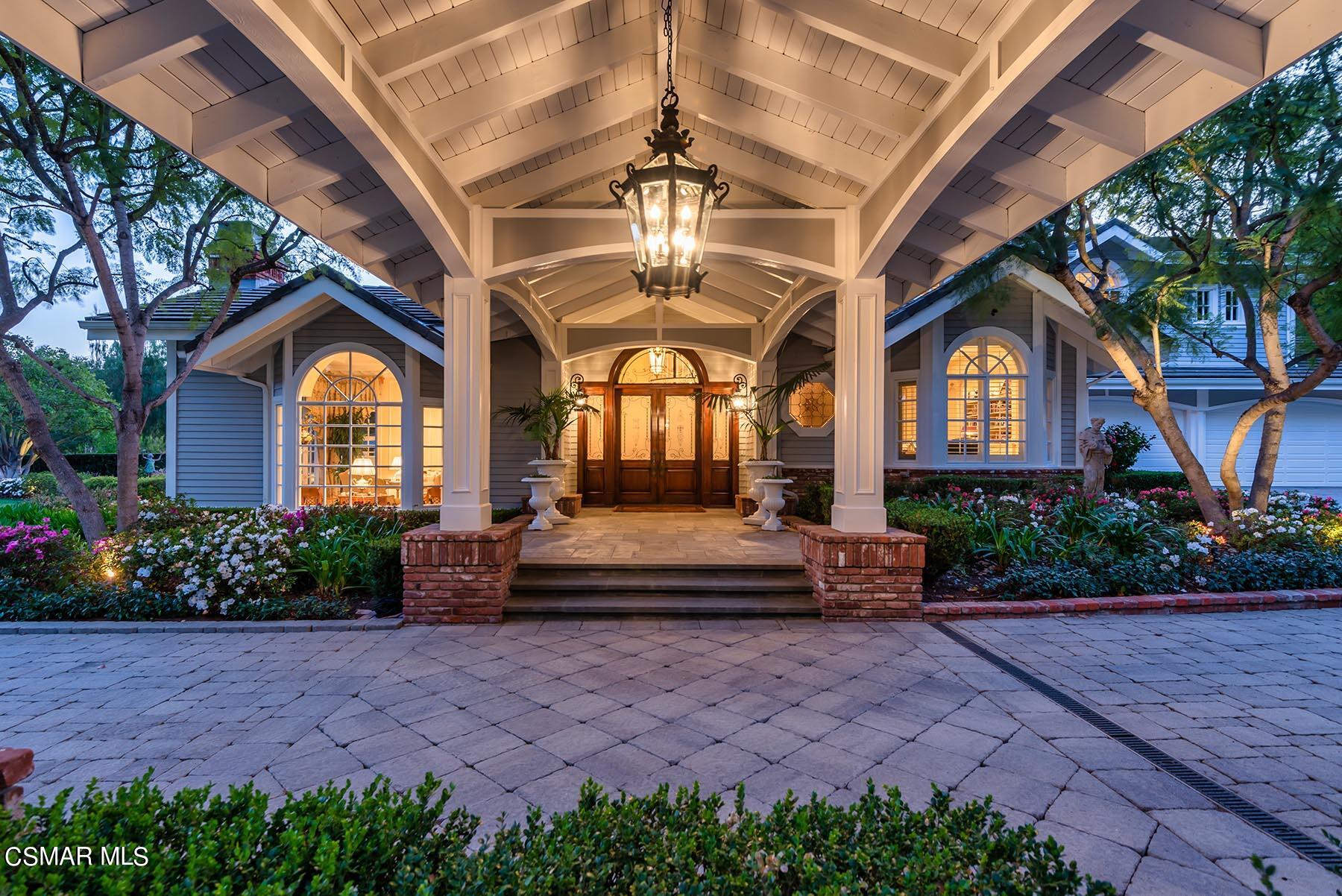 2155 Upper Ranch Road Westlake Village, CA 91362 - Photo 4 of 52 a front view of a house with a garden