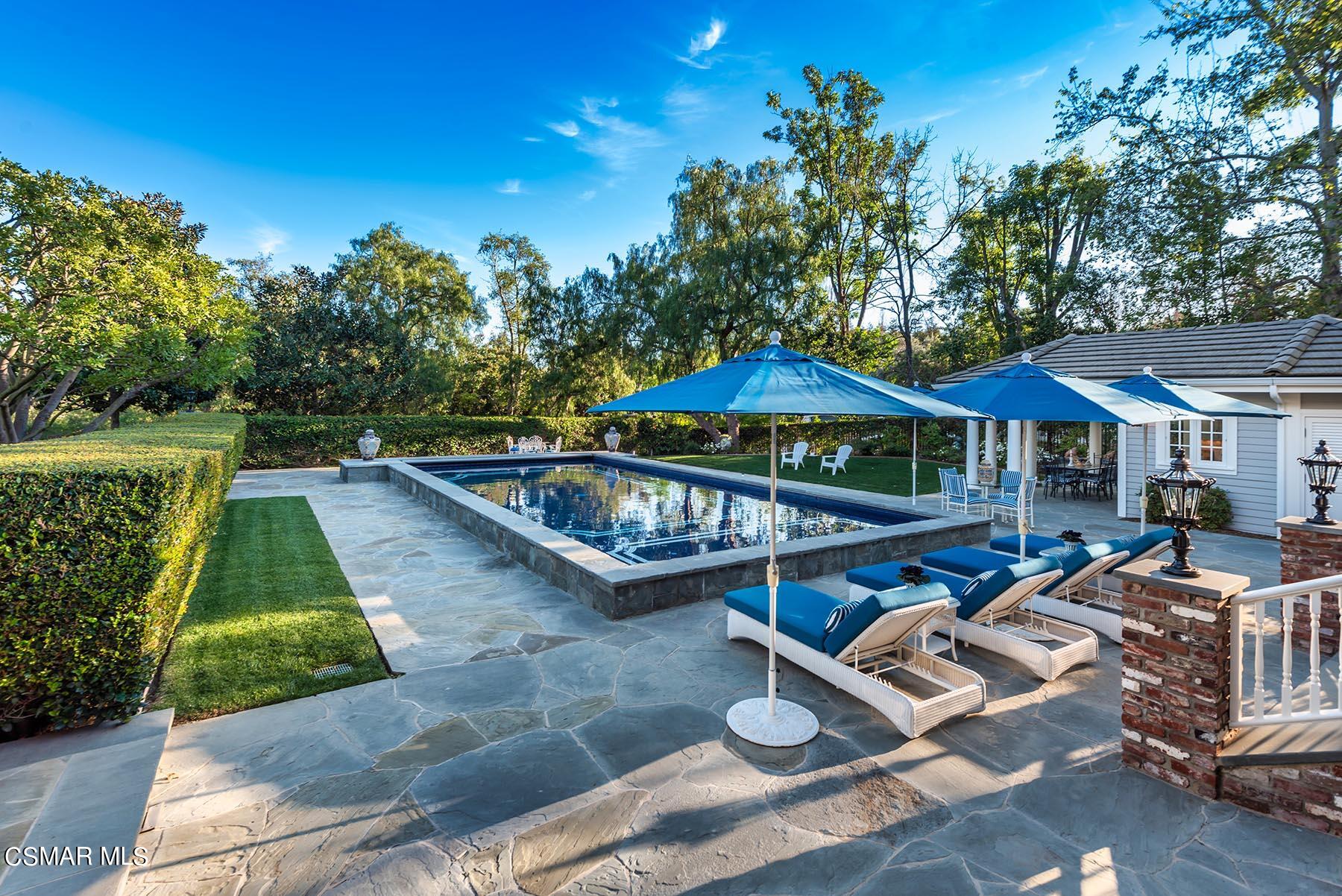2155 Upper Ranch Road Westlake Village, CA 91362 - Photo 46 of 52 a view of swimming pool with lawn chairs under an umbrella