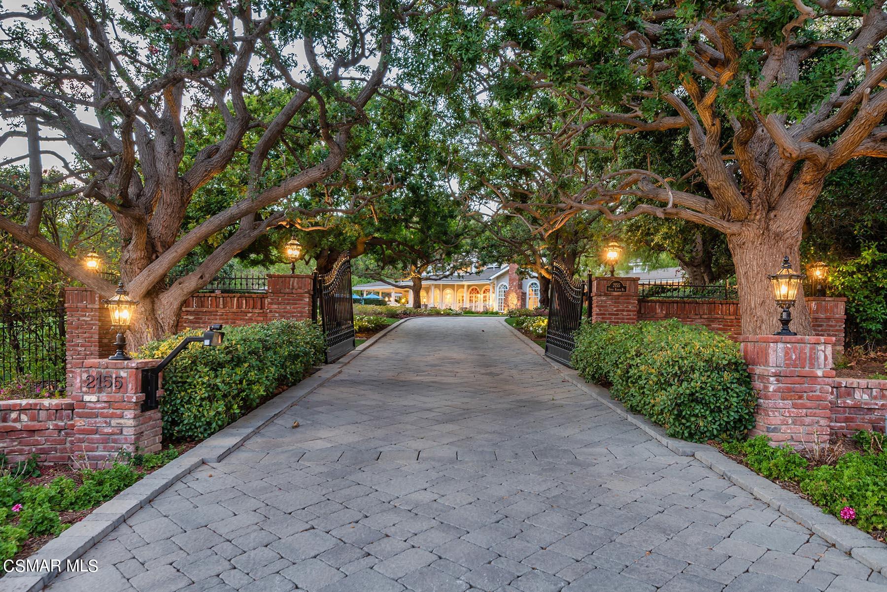 2155 Upper Ranch Road Westlake Village, CA 91362 - Photo 47 of 52 a front view of a house with a yard and a large tree