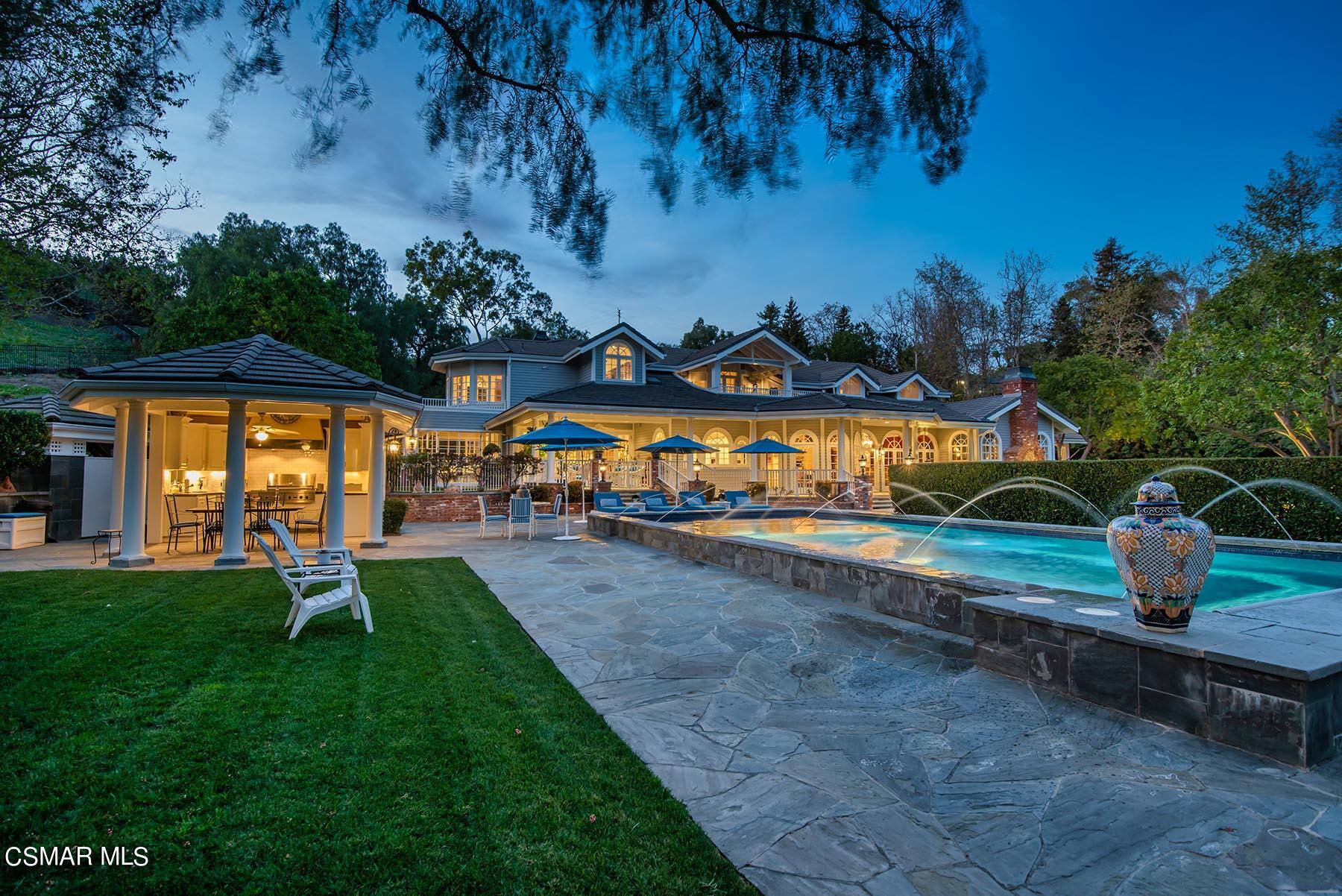 2155 Upper Ranch Road Westlake Village, CA 91362 - Photo 5 of 52 a childrens park with lots of swings slides and swimming pool in the back