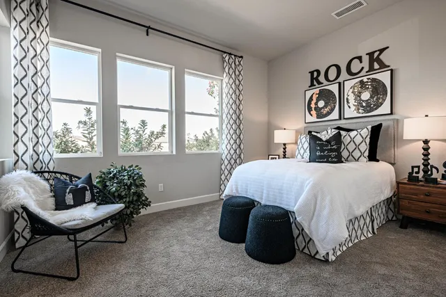 a bedroom with a bed and a couch