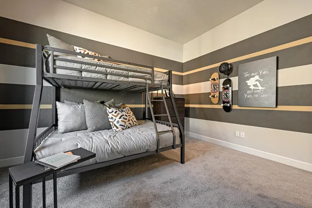 a bedroom with furniture and a ceiling fan