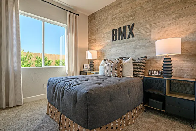 a bedroom with a bed and a window