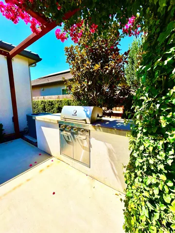 a living room with furniture and flowers
