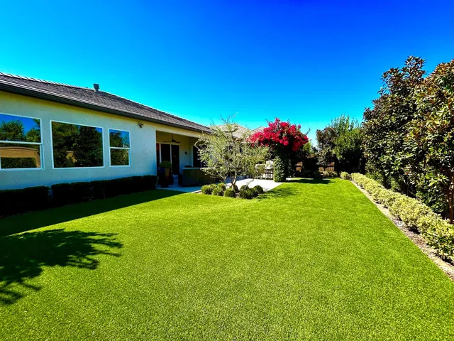 a front view of house with yard and outdoor seating