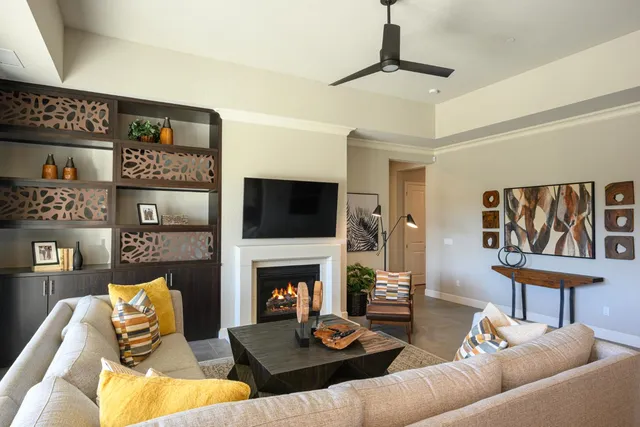 a living room with furniture fireplace and a flat screen tv