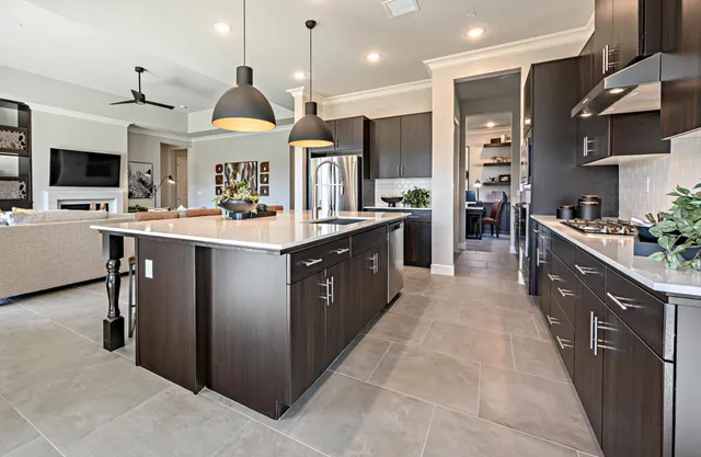 a large kitchen with stainless steel appliances lots of counter top space