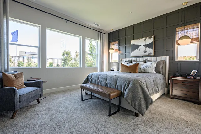 a bedroom with a bed and window