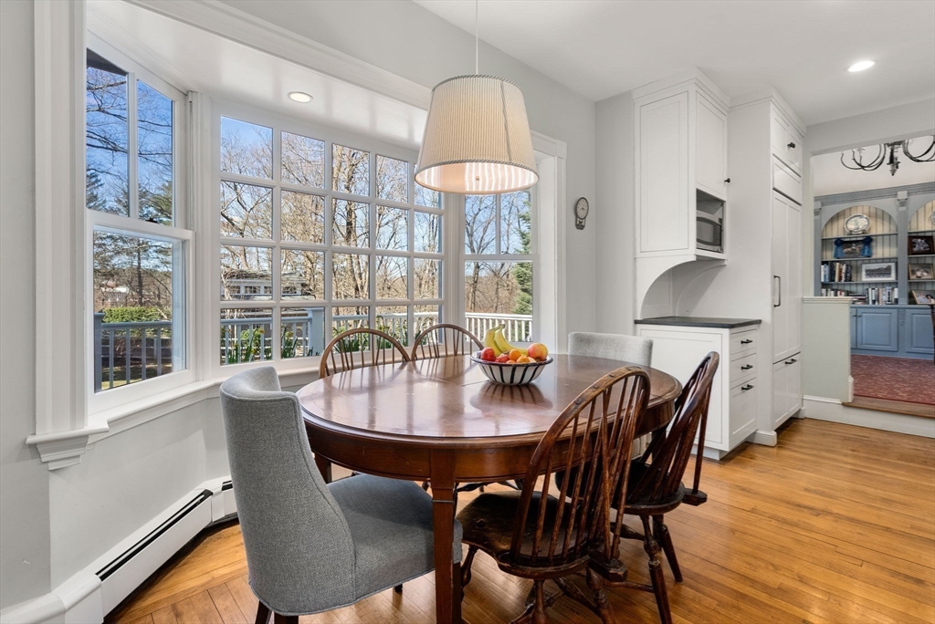 9 Maple Road Weston, MA 02493 - Photo 16 of 35 a dining room with furniture a chandelier and wooden floor