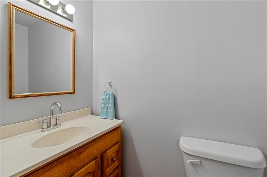 107 East School Street Mars, PA 16046 - Photo 13 of 37 a bathroom with a toilet a sink and mirror
