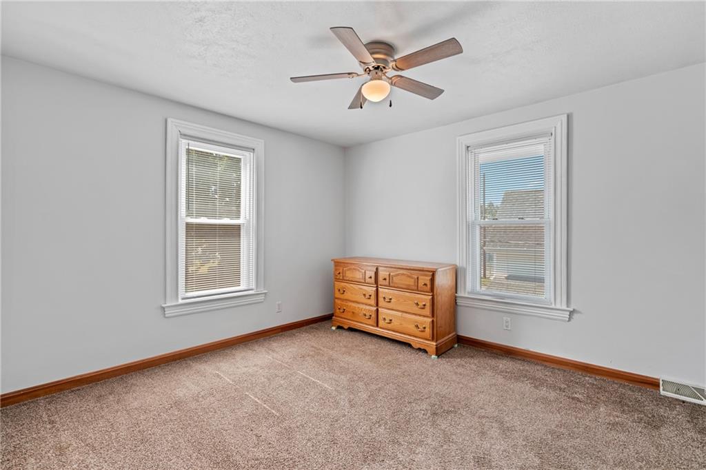 107 East School Street Mars, PA 16046 - Photo 16 of 37 an empty room with windows and fan