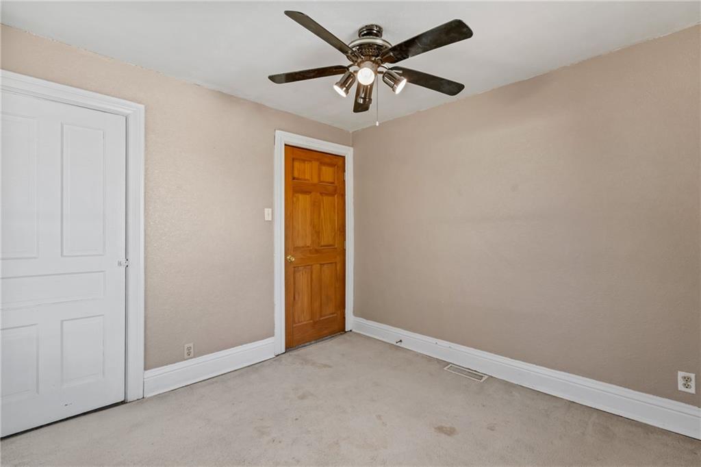 107 East School Street Mars, PA 16046 - Photo 20 of 37 an empty room with a ceiling fan and a window