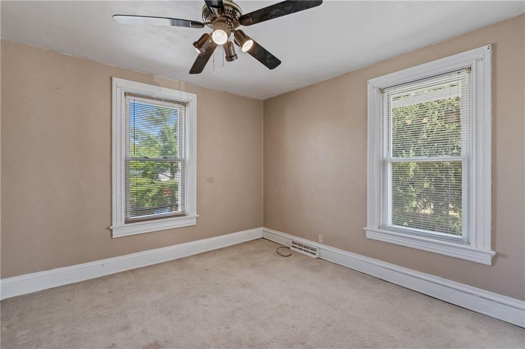 107 East School Street Mars, PA 16046 - Photo 21 of 37 an empty room with a window and a fan