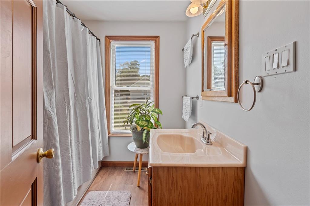 107 East School Street Mars, PA 16046 - Photo 22 of 37 a bathroom with a sink a mirror and a shower