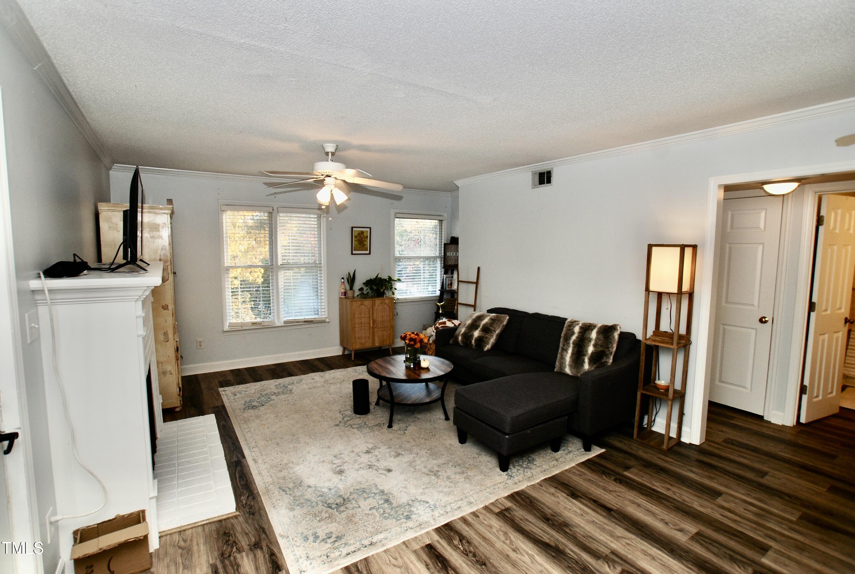2306 Stafford Avenue, Unit B Raleigh, NC 27607 - Photo 2 of 29 a living room with furniture and a fireplace