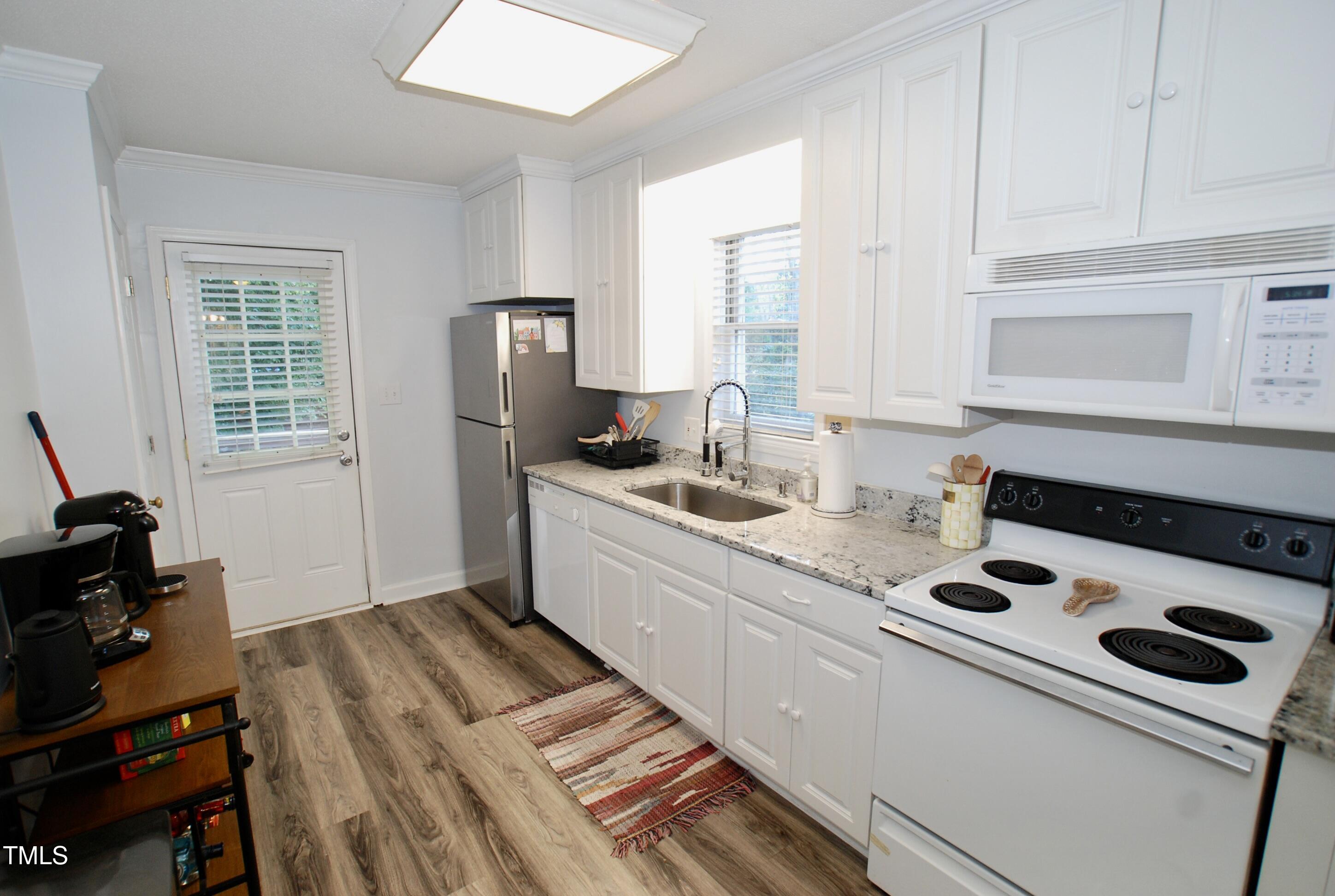 2306 Stafford Avenue, Unit B Raleigh, NC 27607 - Photo 6 of 29 a kitchen with a sink stove and cabinets