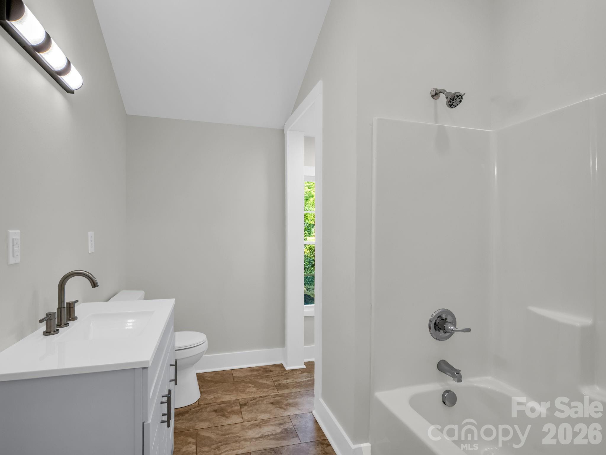 5923 Highway 14 Landrum, SC 29356 - Photo 12 of 15 a bathroom with a sink a toilet and shower