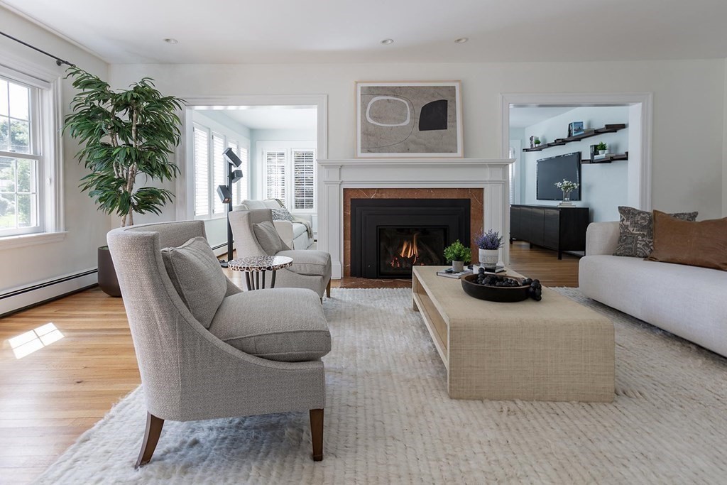 5 Agawam Road Newton, MA 02468 - Photo 3 of 23 a living room with furniture and a fireplace
