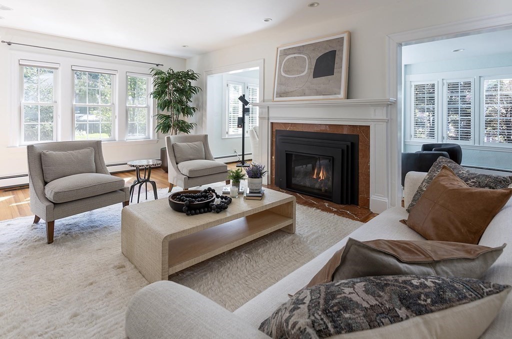 5 Agawam Road Newton, MA 02468 - Photo 4 of 23 a living room with furniture and a fireplace