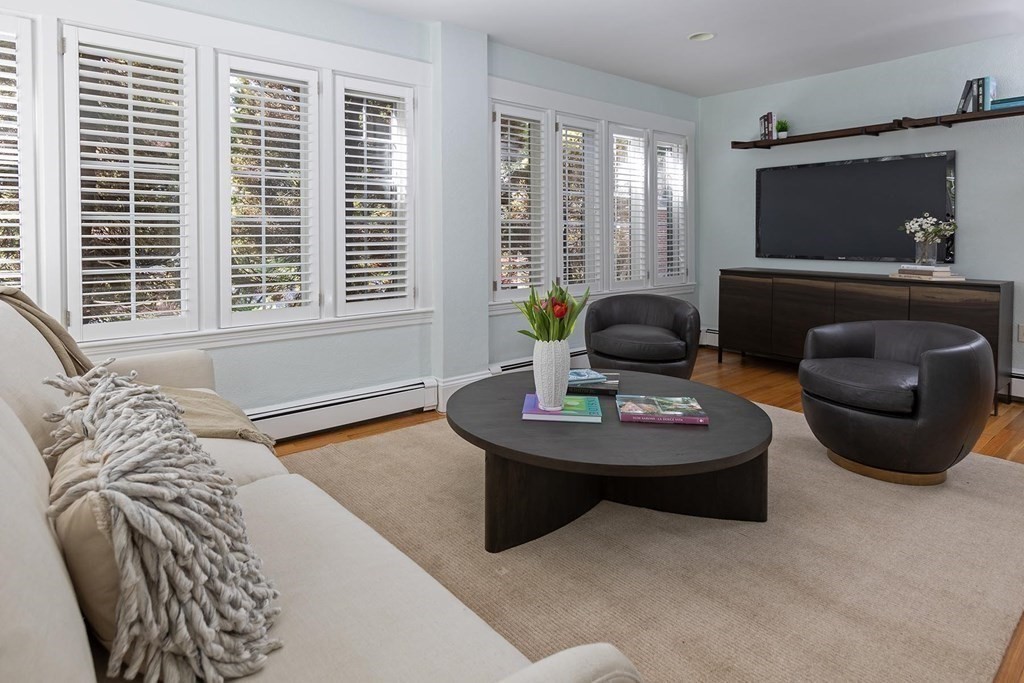 5 Agawam Road Newton, MA 02468 - Photo 5 of 23 a living room with furniture and a flat screen tv