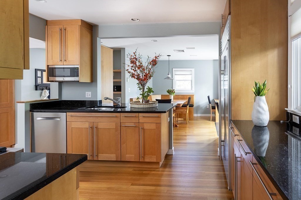 5 Agawam Road Newton, MA 02468 - Photo 8 of 23 a dining hall with stainless steel appliances granite countertop a stove top oven a sink and dishwasher