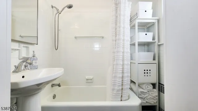 a bathroom with a bathtub and a sink