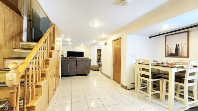 a view of a door with wooden floor and furniture