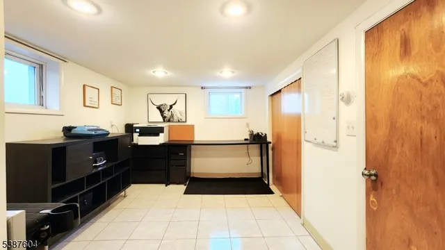 a room with furniture and mirror