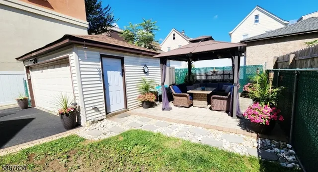 a view of a patio with table and chairs potted plants