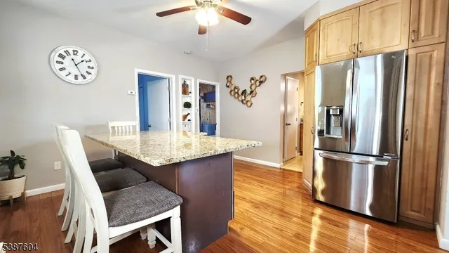 a kitchen with a refrigerator and countertop