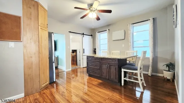 a room with wooden floors and furniture