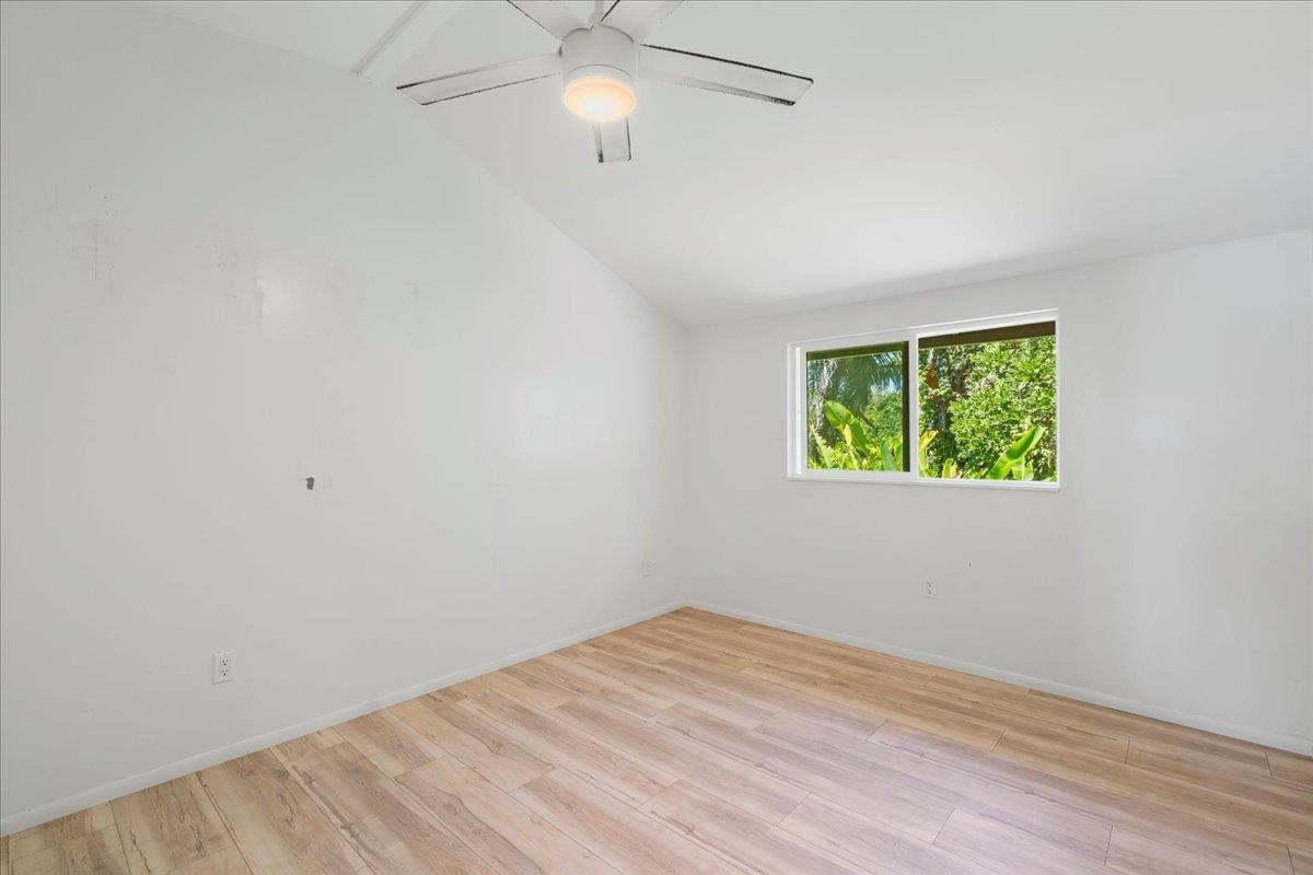 265 Hahana Road Haiku, HI 96708 - Photo 14 of 48 wooden floor in an empty room with a window
