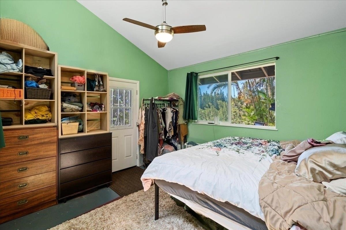 265 Hahana Road Haiku, HI 96708 - Photo 18 of 48 a bed room with furniture and a window