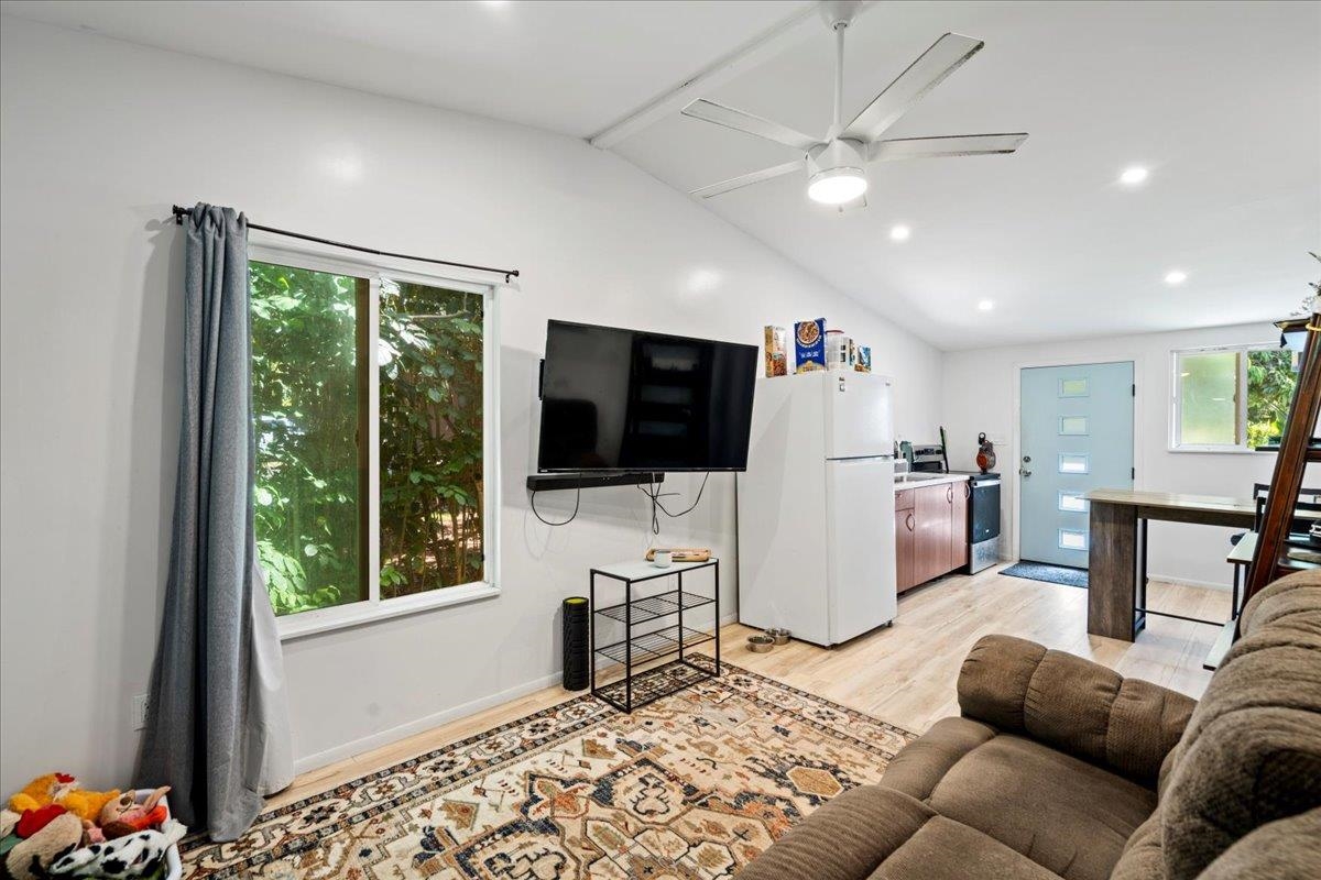 265 Hahana Road Haiku, HI 96708 - Photo 22 of 48 a living room with furniture tv and a window