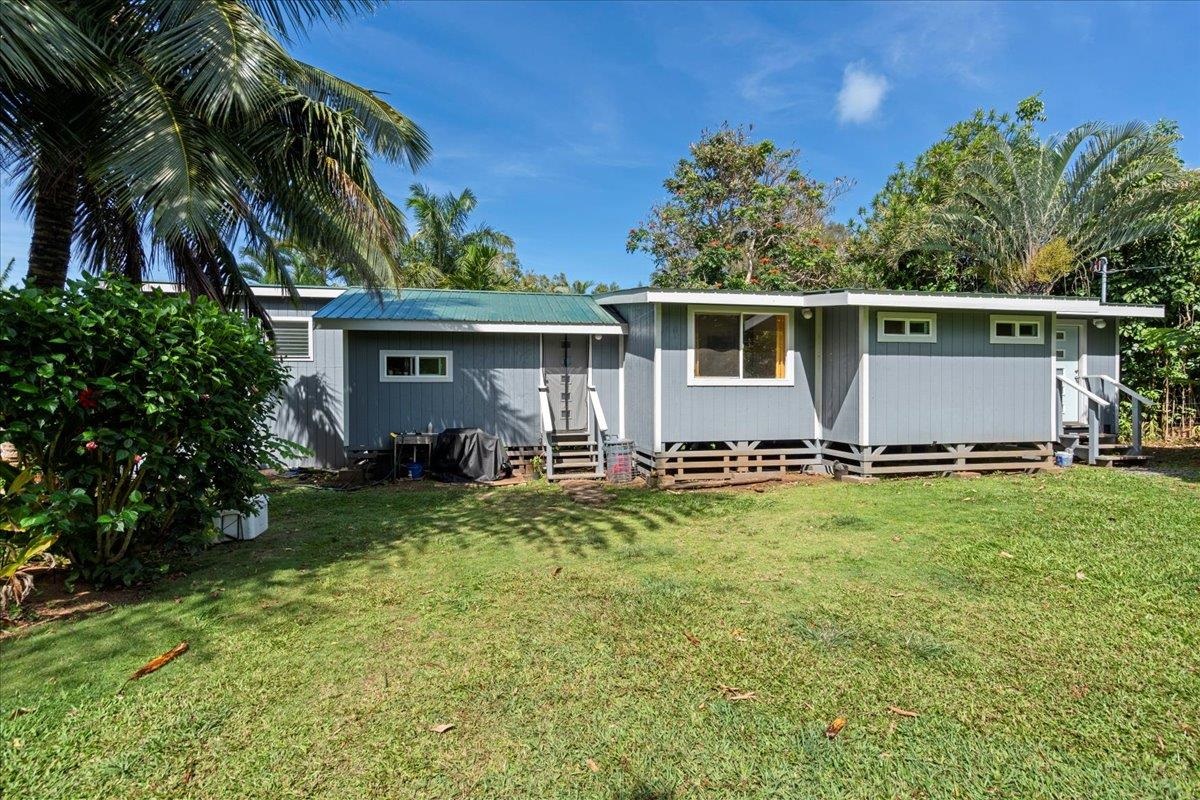 265 Hahana Road Haiku, HI 96708 - Photo 3 of 48 a front view of house with yard and outdoor seating