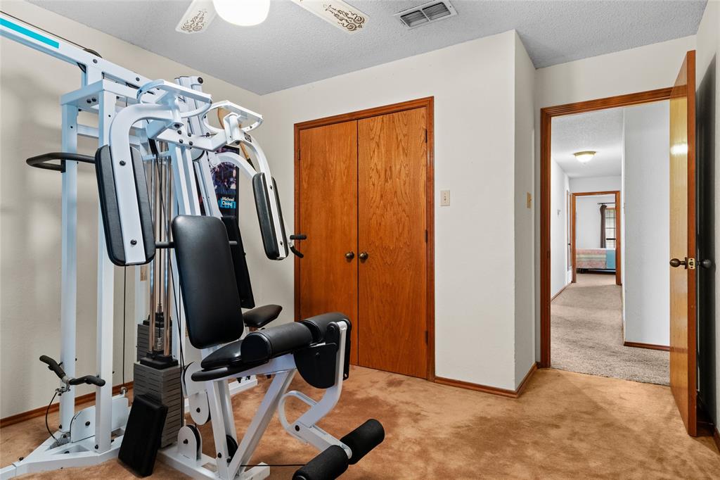 5840 Crystal Drive Midlothian, TX 76065 - Photo 17 of 36 a view of a room with gym equipment