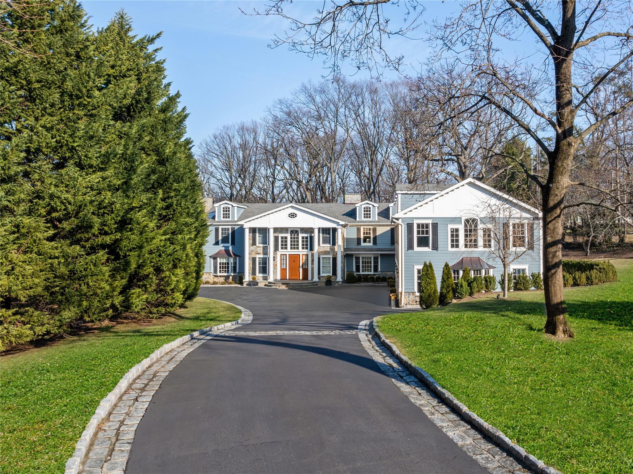 89 Middle Road Sands Point, NY 11050 - Photo 1 of 1 a front view of a house with a yard